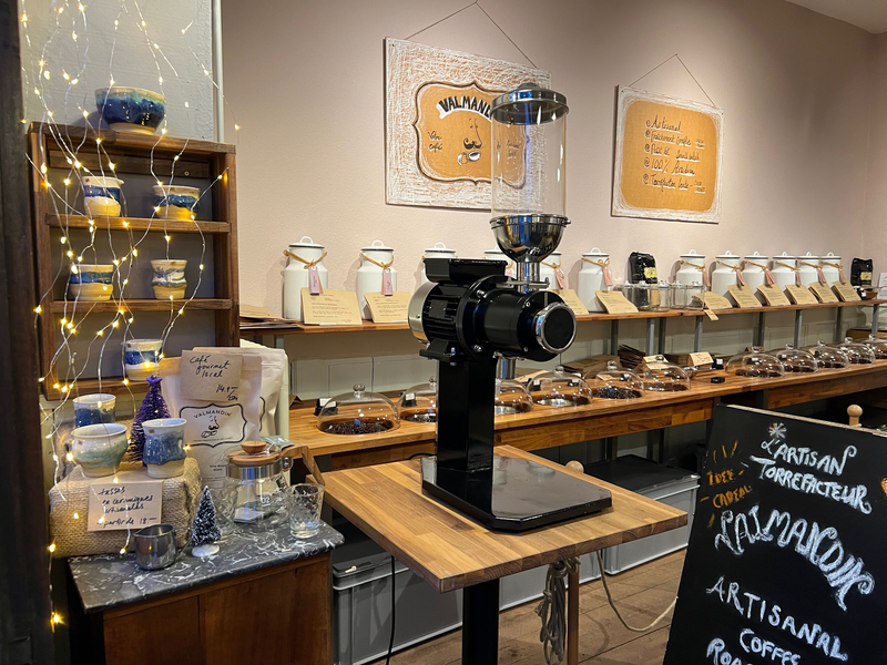 A view of the Valmandin Coffee Shop from the door. The delicious Valmandin Gourmet Coffee protected under glass domes. The freshly roasted Valmandin beans are visible under glass domes.